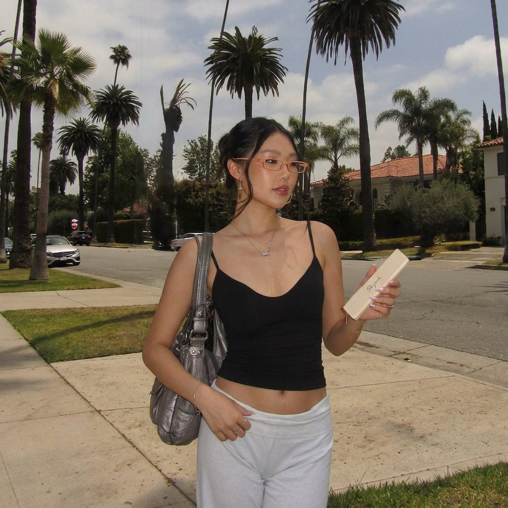 Woman wearing narrow SKYOAK glasses outdoors